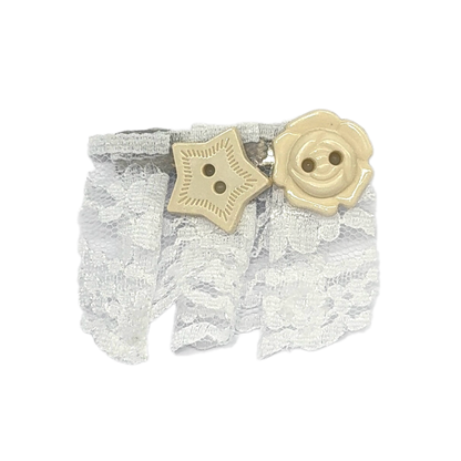 White lace wristband with a beige star-shaped and rose-shaped button embellishment, shown on a plain white background.