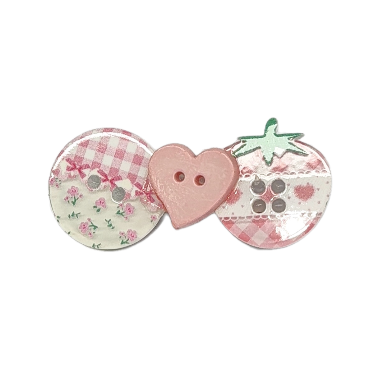 Three decorative buttons arranged side by side on a plain white background: a round button with pink gingham and floral print, a pink heart-shaped button with two holes, and a strawberry-shaped button with green leaves and a pink gingham pattern.